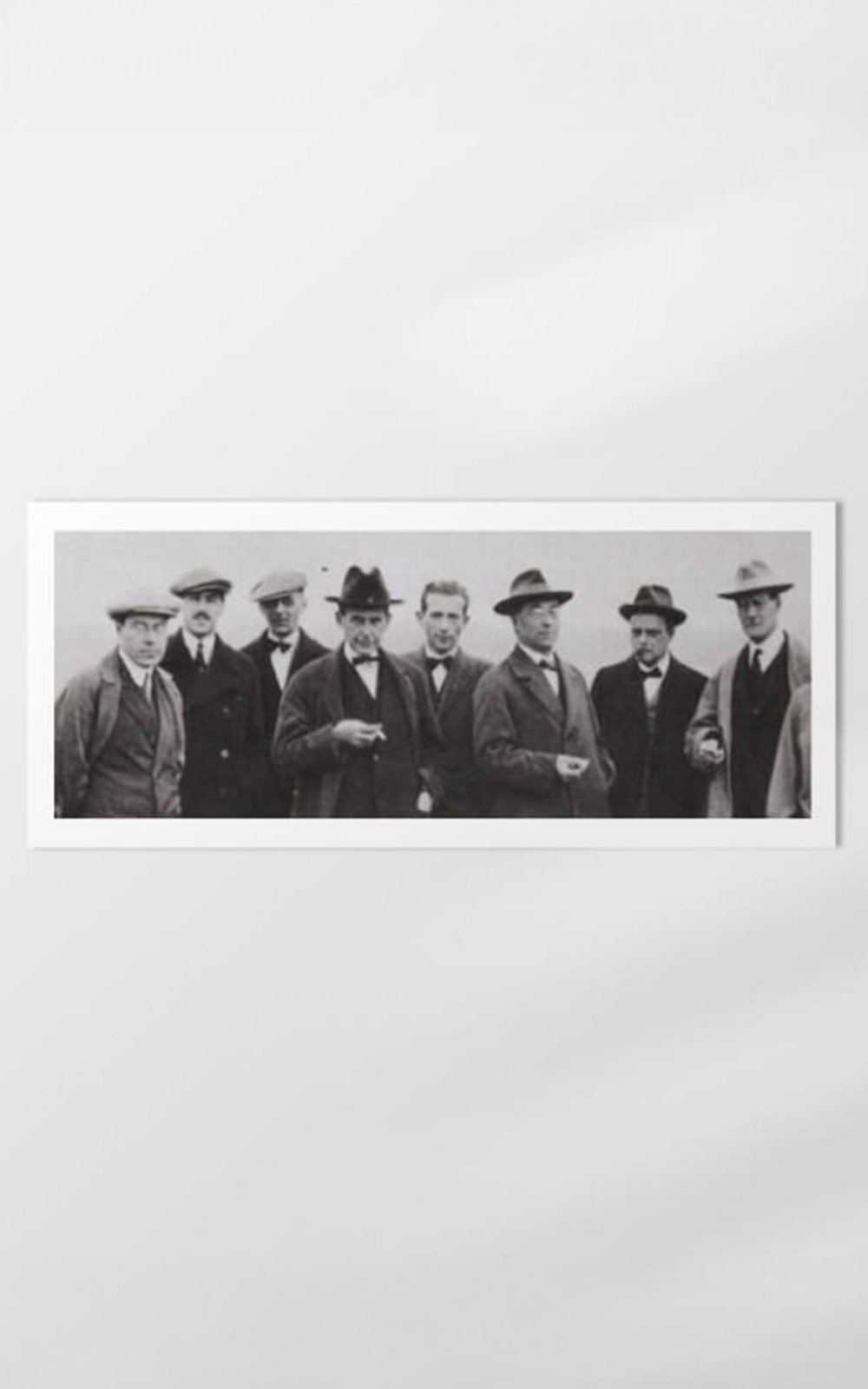 A black and white picture of a group of 8 men. A black and white picture of a group of 8 men.