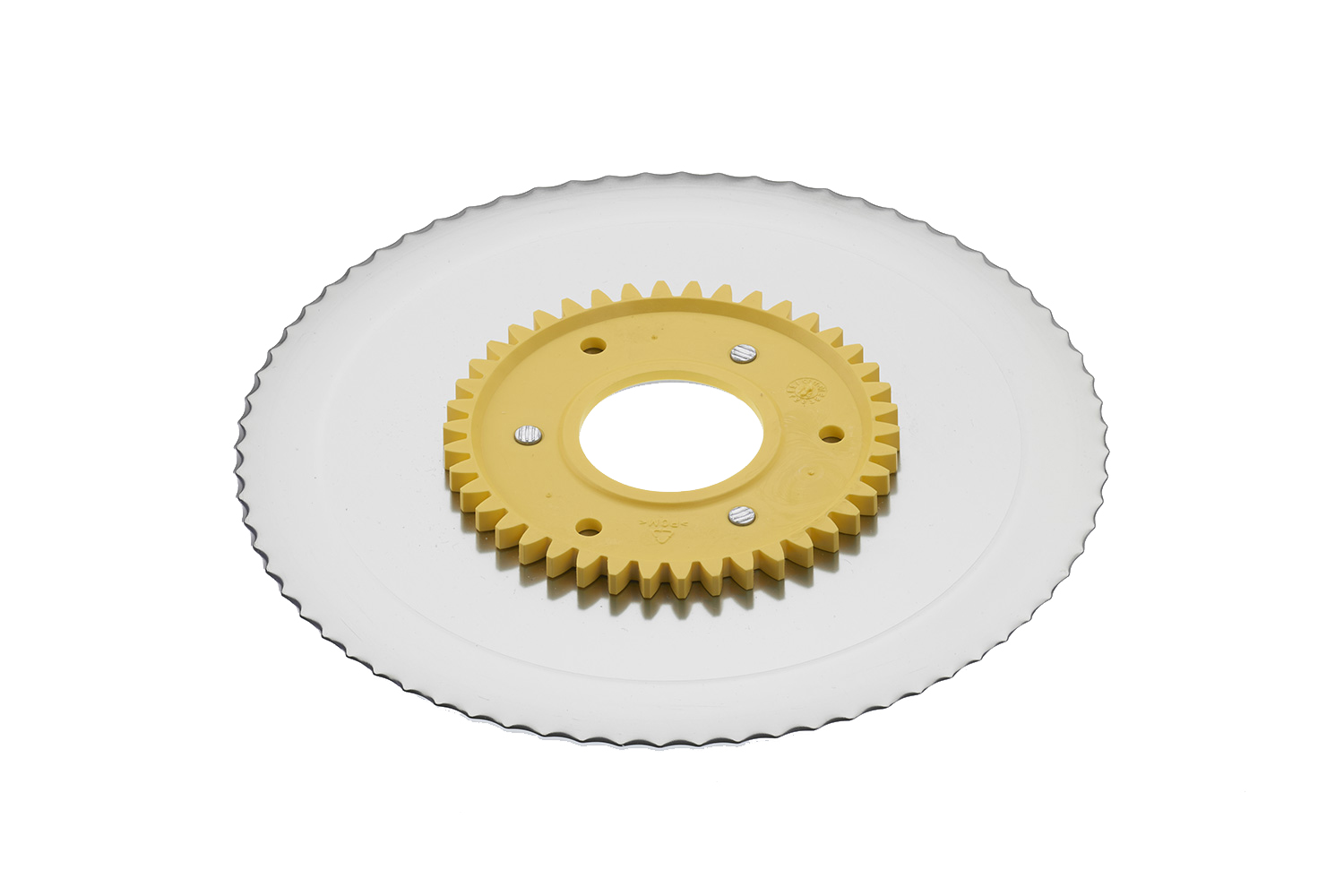 Serrated circular blade with electropolished surface and a yellow gear