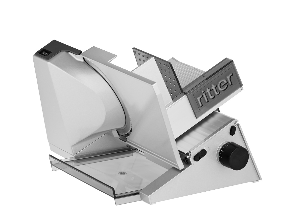 Electric food slicer in silver, angled view