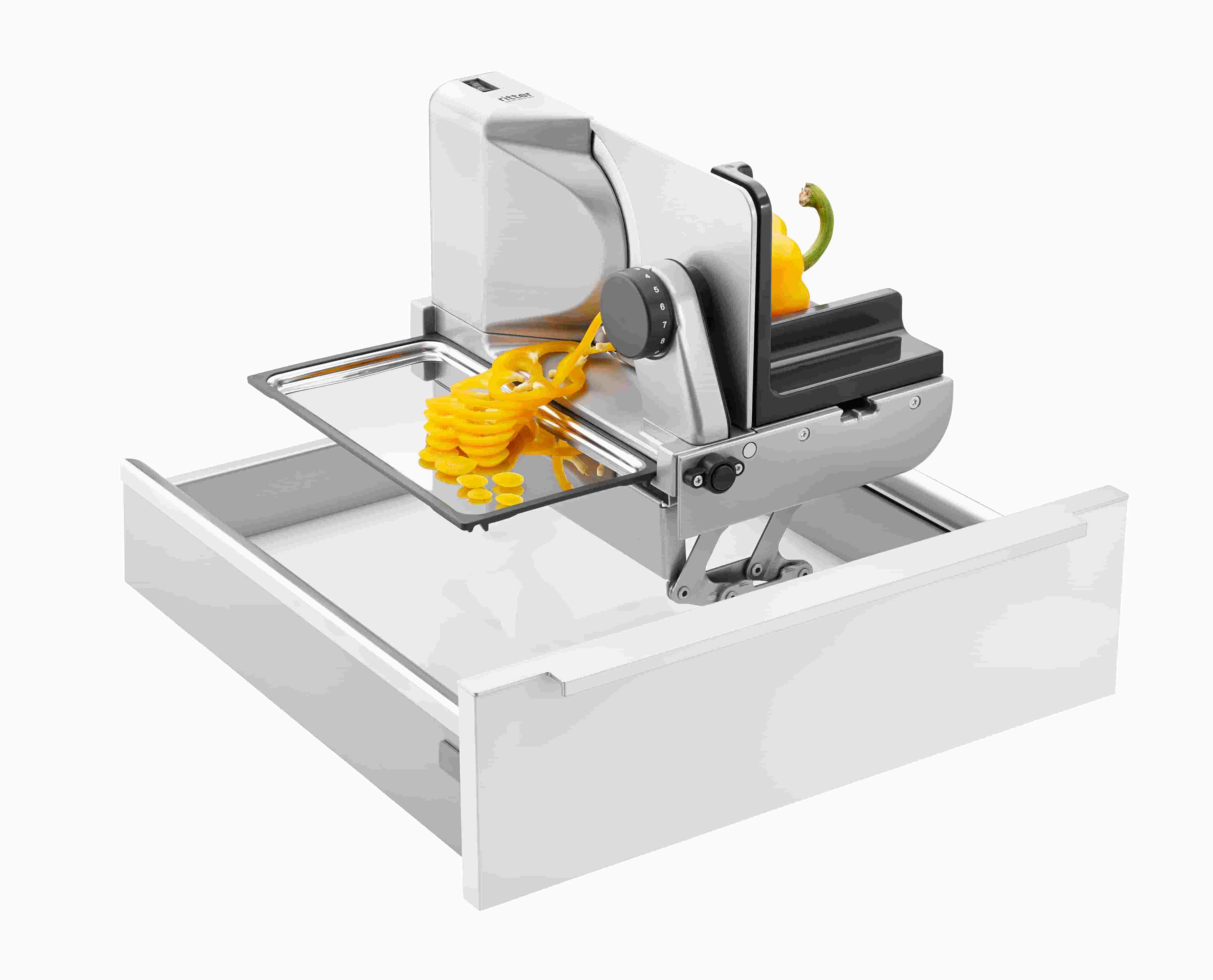 Electric built-in all food slicer in silver, angled view with food to be sliced