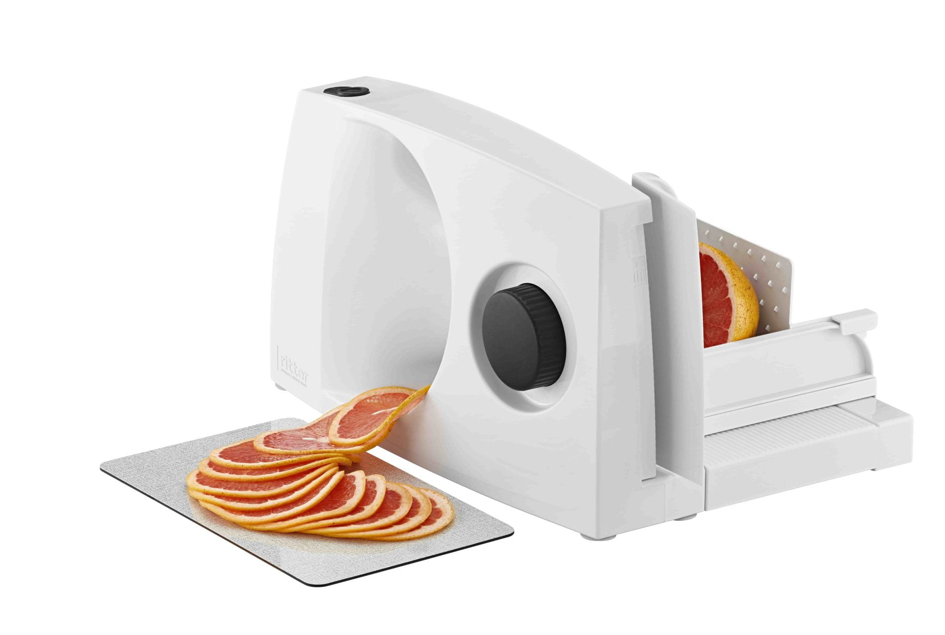 White food slicer made of plastic, side view with sliced grapefruit